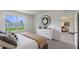 Serene bedroom with a queen-size bed, dresser, and backyard view at 3834 Rory Pond Ct, Lakeland, FL 33811