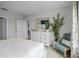 Main bedroom with white dresser and a view into the dining area at 455 Taylor Groves Dr, Lake Wales, FL 33853