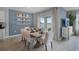 Bright dining room with white table and chairs, and blue accent wall at 455 Taylor Groves Dr, Lake Wales, FL 33853