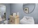 Small bathroom with pedestal sink and mirror at 463 Taylor Groves Dr, Lake Wales, FL 33853