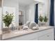 Double vanity bathroom with a large mirror at 463 Taylor Groves Dr, Lake Wales, FL 33853