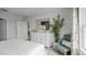 Main bedroom with white dresser and access to other rooms at 463 Taylor Groves Dr, Lake Wales, FL 33853