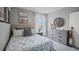 Bedroom with surfing theme and dresser at 463 Taylor Groves Dr, Lake Wales, FL 33853