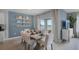 Bright dining room with a table for six and access to patio at 463 Taylor Groves Dr, Lake Wales, FL 33853