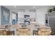Modern kitchen with island, stainless steel appliances, and white cabinetry at 463 Taylor Groves Dr, Lake Wales, FL 33853