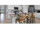 Modern kitchen with white cabinets, a large island, and stainless steel appliances at 463 Taylor Groves Dr, Lake Wales, FL 33853