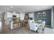 Open concept kitchen and dining area with white cabinets and a breakfast bar at 463 Taylor Groves Dr, Lake Wales, FL 33853