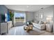 Relaxing living room featuring a sectional sofa, coffee table, and large window at 463 Taylor Groves Dr, Lake Wales, FL 33853