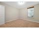 Empty bedroom with neutral wall colors and carpeted floor at 598 S Shell Rd, Deland, FL 32720