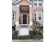 Inviting exterior of a townhome with a covered entryway and landscaping at 6648 Time Square Ave # 104, Orlando, FL 32835