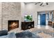 Modern fireplace with stone facing in living room at 70 Sable Ct, Winter Springs, FL 32708