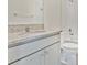 Bathroom with granite countertop, single sink vanity, and a bathtub at 7836 June Ln, Wildwood, FL 34785