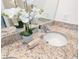 Elegant bathroom featuring a granite countertop and double sink at 7836 June Ln, Wildwood, FL 34785