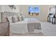 Spacious bedroom with large window and plush carpeting at 7836 June Ln, Wildwood, FL 34785