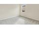 Spacious bedroom with window and neutral wall colors at 7836 June Ln, Wildwood, FL 34785
