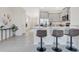 Modern kitchen with gray cabinets, breakfast bar and stylish decor at 7836 June Ln, Wildwood, FL 34785