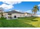 Spacious backyard with patio and grassy area at 813 Sterling Spring Rd, Orlando, FL 32828