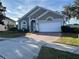 One-story home with landscaped yard and two-car garage at 846 Andalusia Loop, Davenport, FL 33837