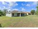 House with large backyard and screened patio at 9264 Lake Fischer Blvd, Gotha, FL 34734