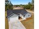 New construction home with driveway and landscaping at 1041 Ne 130Th Ter, Silver Springs, FL 34488