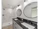 Modern bathroom with double vanity and walk-in shower at 1041 Ne 130Th Ter, Silver Springs, FL 34488