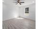 Spacious bedroom featuring wood-look floors and a ceiling fan at 1041 Ne 130Th Ter, Silver Springs, FL 34488