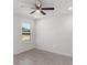 Bright bedroom with wood-look floors and a ceiling fan at 1041 Ne 130Th Ter, Silver Springs, FL 34488