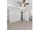 Spacious bedroom with ceiling fan and en-suite bathroom at 1041 Ne 130Th Ter, Silver Springs, FL 34488