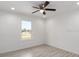 Well-lit bedroom with wood-look floors and a ceiling fan at 1041 Ne 130Th Ter, Silver Springs, FL 34488