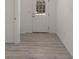 Light and airy entryway with wood-look flooring at 1041 Ne 130Th Ter, Silver Springs, FL 34488