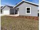 House exterior with gray siding and landscaping at 1041 Ne 130Th Ter, Silver Springs, FL 34488