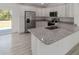 Kitchen with granite countertops and stainless steel appliances at 1041 Ne 130Th Ter, Silver Springs, FL 34488