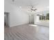 Open living room with wood-look floors and natural light at 1041 Ne 130Th Ter, Silver Springs, FL 34488