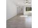Living room with light gray vinyl flooring and a ceiling fan at 1041 Ne 130Th Ter, Silver Springs, FL 34488