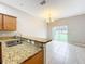 Modern kitchen with stainless steel appliances and granite countertops at 10951 Savannah Landing Cir, Orlando, FL 32832