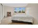 Well-lit bedroom with a double bed and large windows offering a view of the outdoors at 1127 Encourte Grn, Apopka, FL 32712