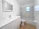 Updated bathroom with a white vanity and tub shower at 14837 Siplin Rd, Winter Garden, FL 34787