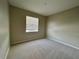 Bright bedroom with carpet and window coverings at 2742 Carrickton Cir, Orlando, FL 32824