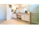 Elegant bathroom with double vanity, granite counters, and large walk-in shower at 4027 Oakrise Loop, Davenport, FL 33837