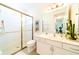 Clean bathroom with a shower/tub combo, vanity, and stylish decor at 4027 Oakrise Loop, Davenport, FL 33837