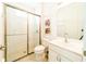 Clean bathroom with shower/tub combo and white vanity at 4027 Oakrise Loop, Davenport, FL 33837