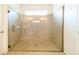 Large walk-in shower with glass enclosure and neutral tile at 4027 Oakrise Loop, Davenport, FL 33837