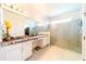Bathroom features granite vanity and large walk-in shower at 4027 Oakrise Loop, Davenport, FL 33837