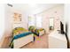 Cozy bedroom with twin beds, butterfly wall decals, and plenty of natural light at 4027 Oakrise Loop, Davenport, FL 33837