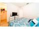 Bright bedroom with king bed, walk-in closet, and built-in TV at 4027 Oakrise Loop, Davenport, FL 33837