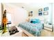 King bedroom with modern decor and a view into another room at 4027 Oakrise Loop, Davenport, FL 33837