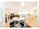 Elegant dining area offering a view of the living room and kitchen at 4027 Oakrise Loop, Davenport, FL 33837