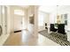 Elegant entryway with high ceilings, modern light fixture and adjacent dining area at 4027 Oakrise Loop, Davenport, FL 33837