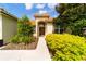 House exterior with landscaped yard and walkway at 4027 Oakrise Loop, Davenport, FL 33837