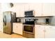 Stainless steel appliances and granite countertops highlight this kitchen at 4027 Oakrise Loop, Davenport, FL 33837
